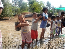 Kids planting mangroves 