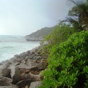 The Anse Kerlan coastline in Praslin, Seychelles now lined with rock armouring to protect from erosion.