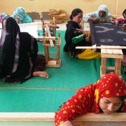 Collective effort by women on completing hand embroidery orders in Kakapir, Karachi, Pakistan