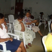 Community member in Takamaka district discusses development impacts in a meeting organised by the Large project grantees