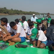 Students on a boat tour of the mangrove forests as part of the awareness camp