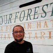 Yus Rusila Noor in front of the Ranger office of Sembilang National Park, South Sumatra