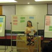 A participant presenting the results of group discussion