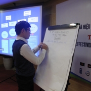 A participant presenting the group discussion's results