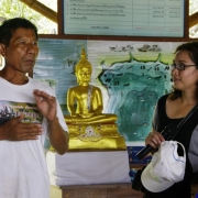 Local resource person explains the concept behind the "mangrove wall" that collects sediment and prevents coastal erosion in the area. MFF Thailand National Coordinator Dr Orathai Pongruktham looks on.