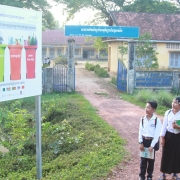 Signboard with primary school students in Tuol Torteung commune