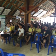 Marriott associates listening to the village headman of Bang Kaeo in Samut Songkhram, one of the mangrove planting sites in Thailand