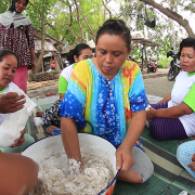 Rustima (centre) and her women's group make fish crackers