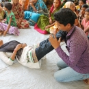 Children demonstrate first aid techniques for use in disaster situations