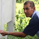 A rainwater collection pipe system is showcased during the PLI Pilot Workshop field trip