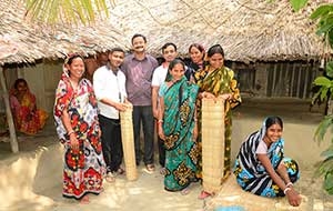 Group of women standing with mats