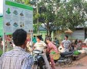 Promotional signboard on how to produce natural composts from the garbage installed in the local market area in Toul Toeteung Commune, Cambodia
