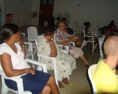 Community member in Takamaka district discusses development impacts in a meeting organised by the Large project grantees