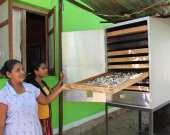 MFF project beneficiaries show off the new fish dehydrator machine