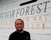 Yus Rusila Noor in front of the Ranger office of Sembilang National Park, South Sumatra