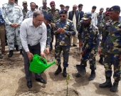 Mahmood Akhtar Cheema, IUCN Pakistan Country Representative, plants a mangrove