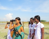 Youth and students observe birds in celebration of International Migratory Bird Day in Jaffna, Sri Lanka