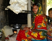 Mrs Beauty Das using improved cooking stove in Cox's Bazar, Bangladesh