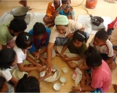 Teaching children how to process local food from mangrove