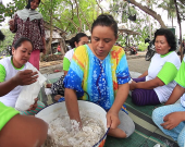 Rustima (centre) and her women's group make fish crackers