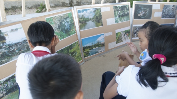 Students attending an exhibition on water pollution