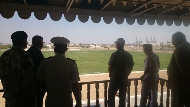 People looking at a sports field