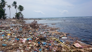 Dump site of a typical Maldivian island. Waste is dumped near the beach, polluting waterways.