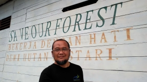 Yus Rusila Noor in front of the Ranger office of Sembilang National Park, South Sumatra