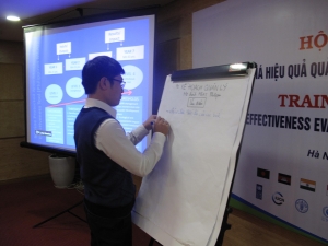 A participant presenting the group discussion's results