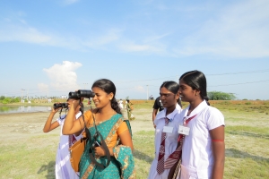 Youth and students observe birds in celebration of International Migratory Bird Day in Jaffna, Sri Lanka