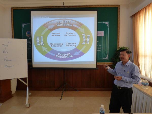 A guest speaker gives a presentation on Project Cycle Management