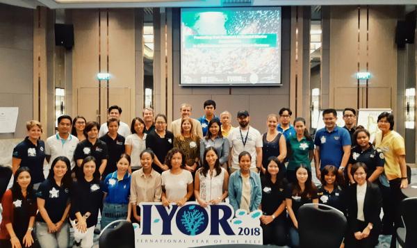 Group photo with four participants holding a sign that reads 'IYOR'